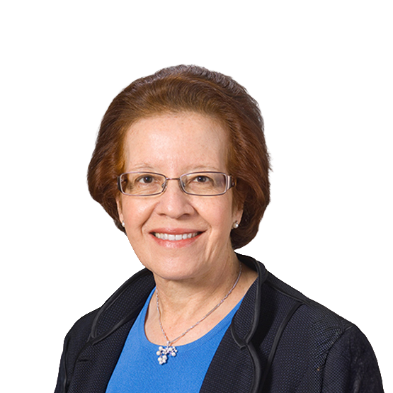 headshot of a woman with light skin, short red hair, and glasses